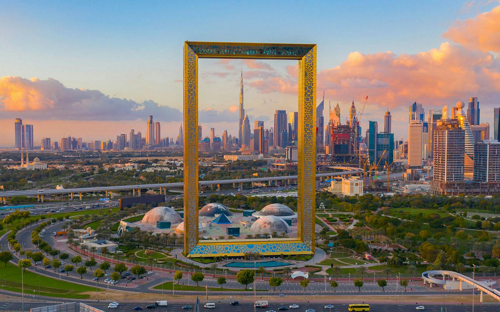 Traditional Emirati heritage building with archway and reflecting pool